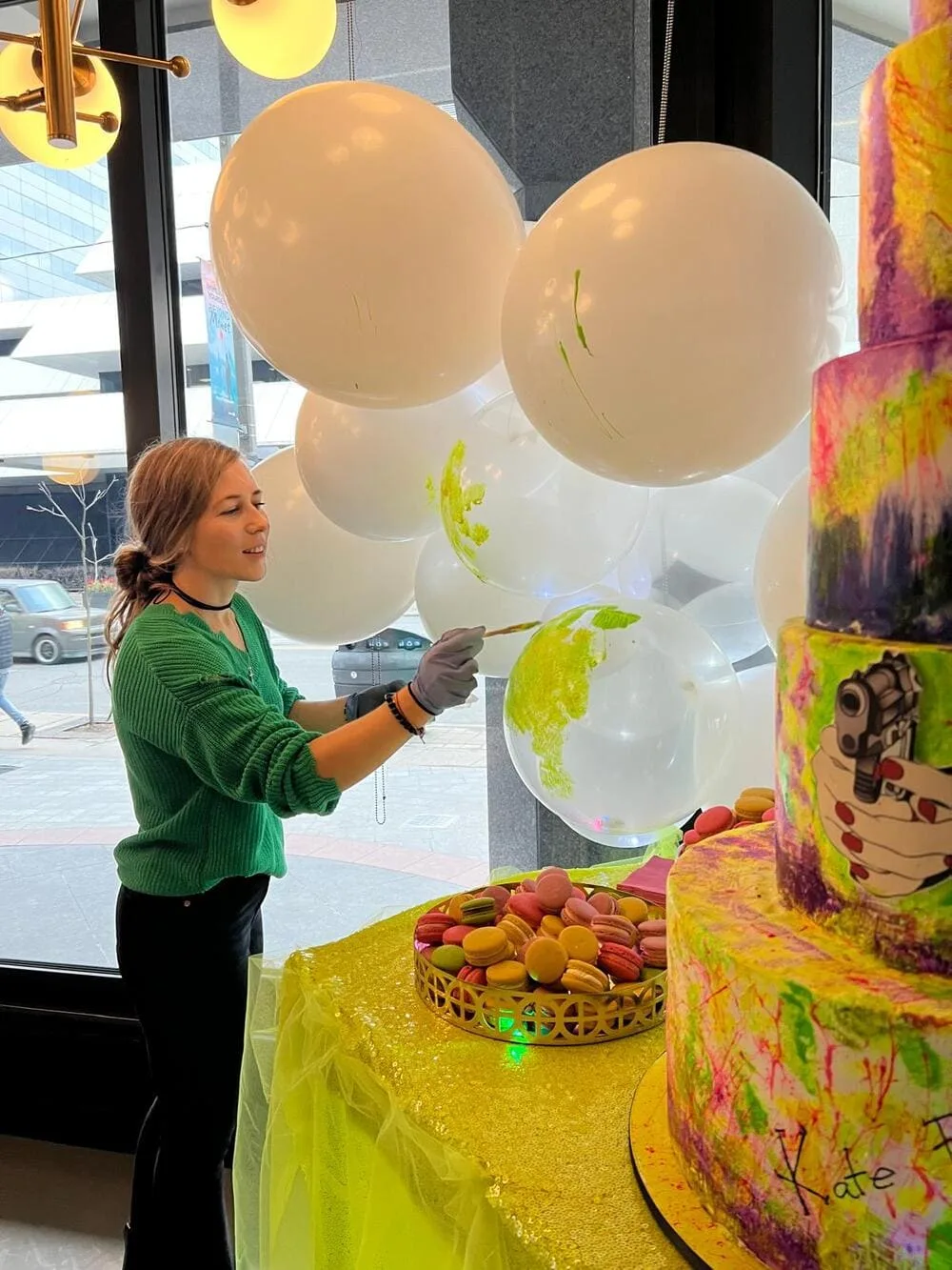 Happy Day Toronto decorator preparing custom balloons for a colourful celebration