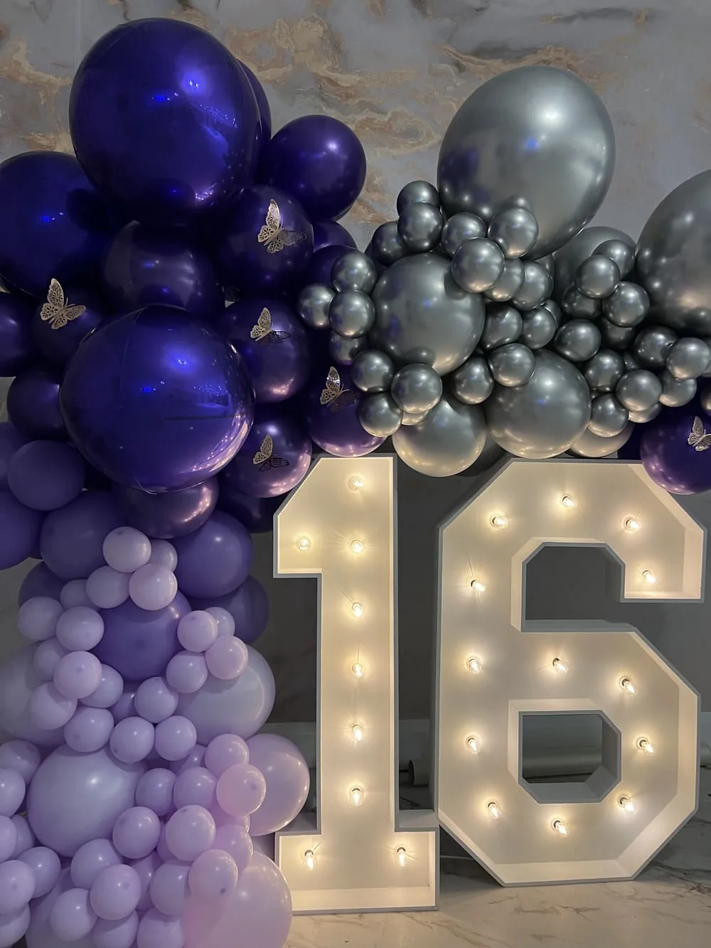 Marquee numbers framed with coordinated balloon decor