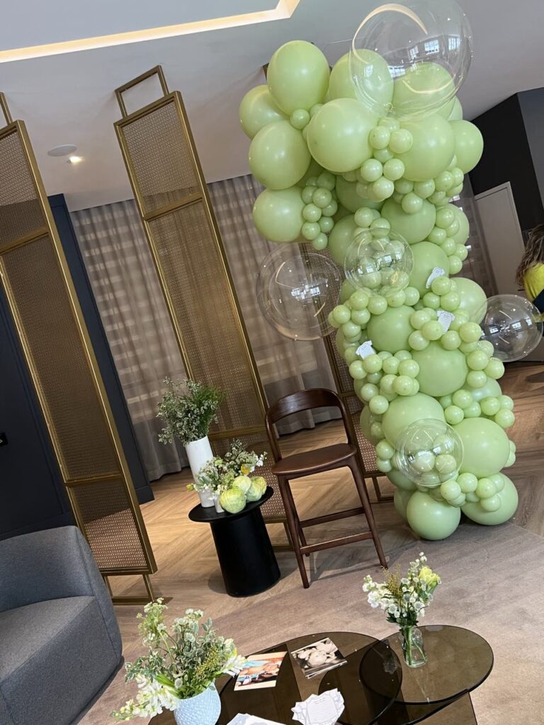 Green baby shower balloon garland