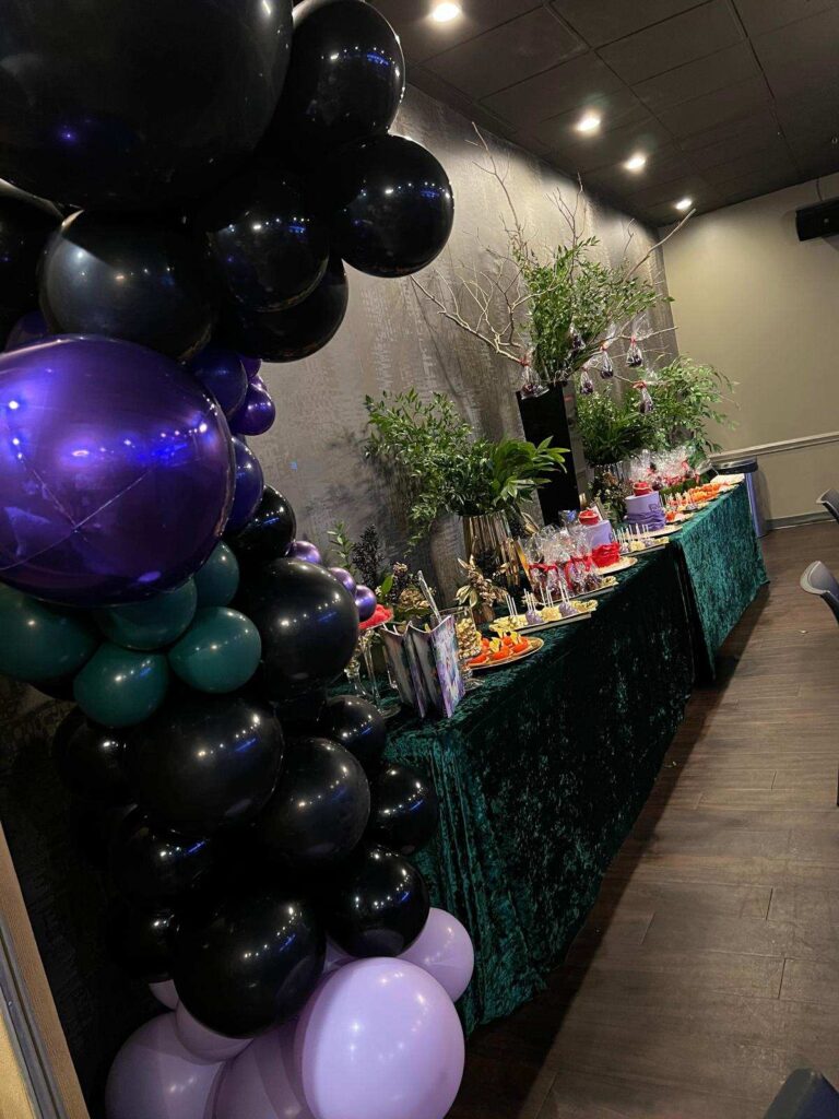 Black and purple balloon arch