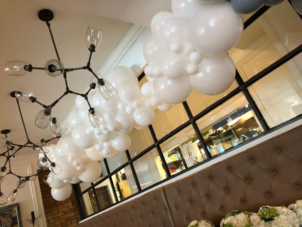 White ceiling balloon garland