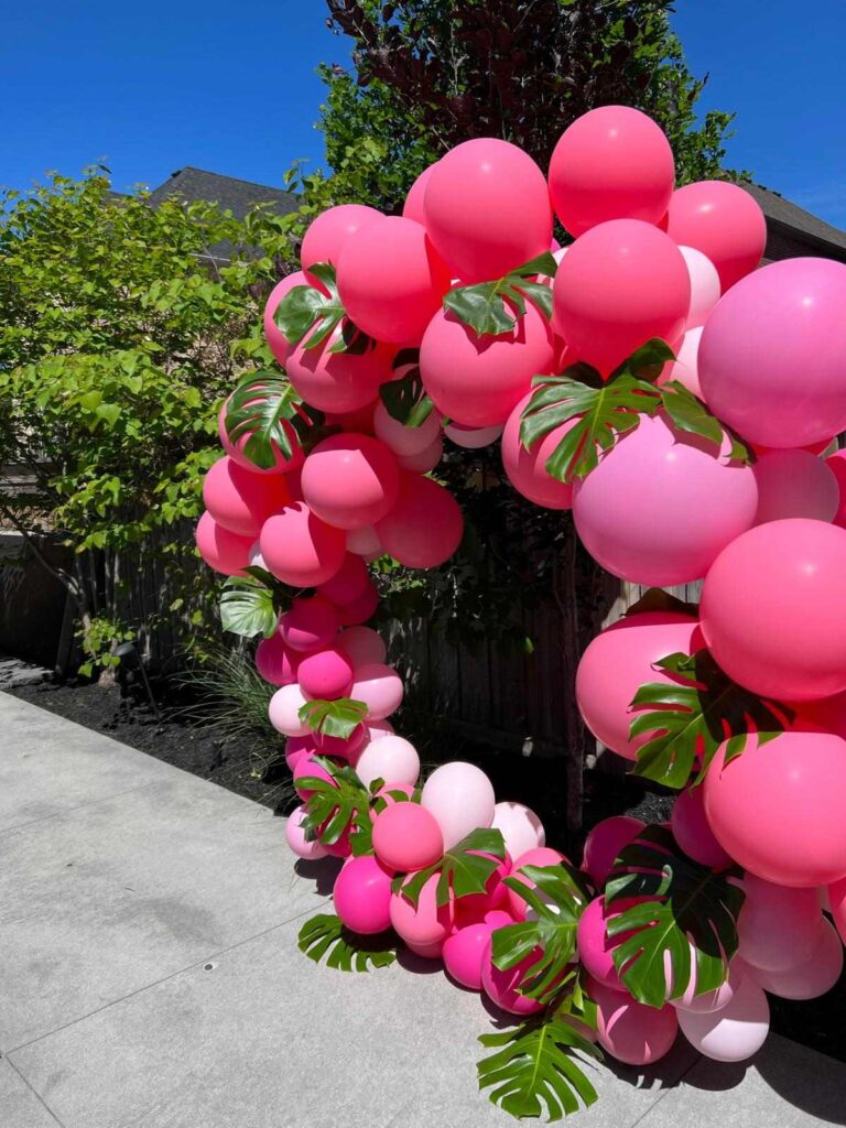 Pink tropical balloon arch