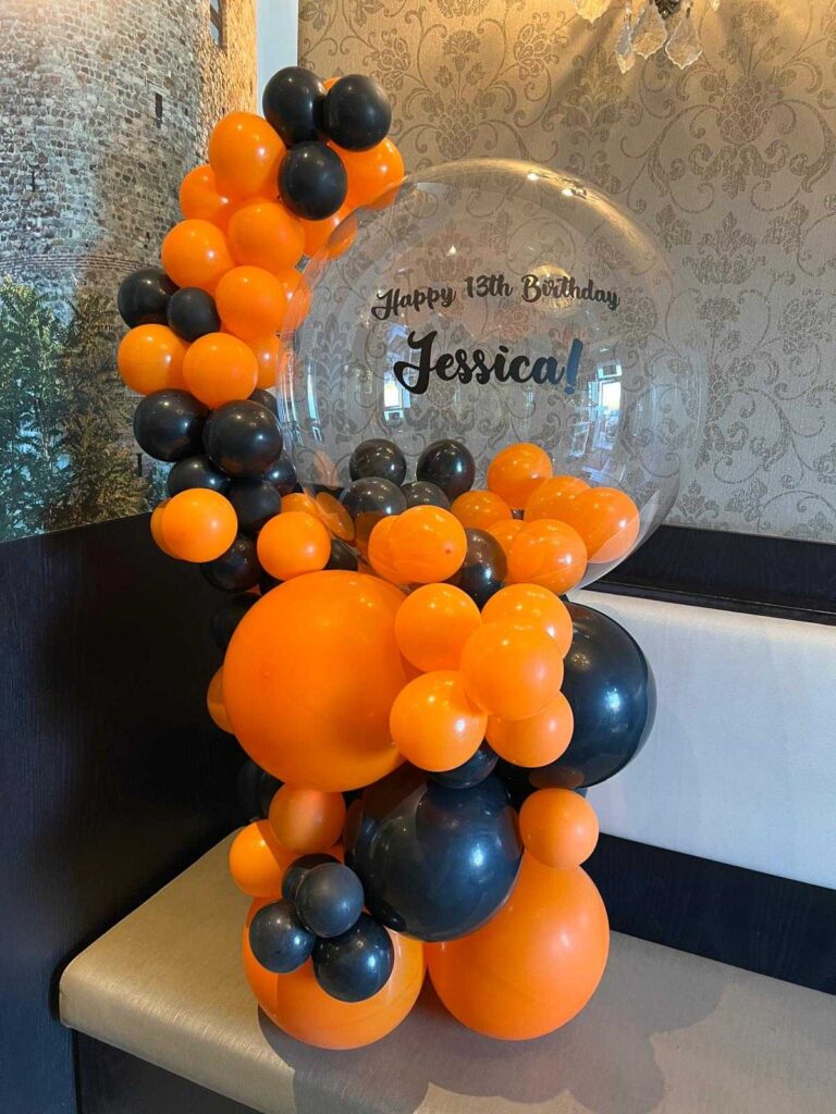 Orange and black 13th birthday balloon decor