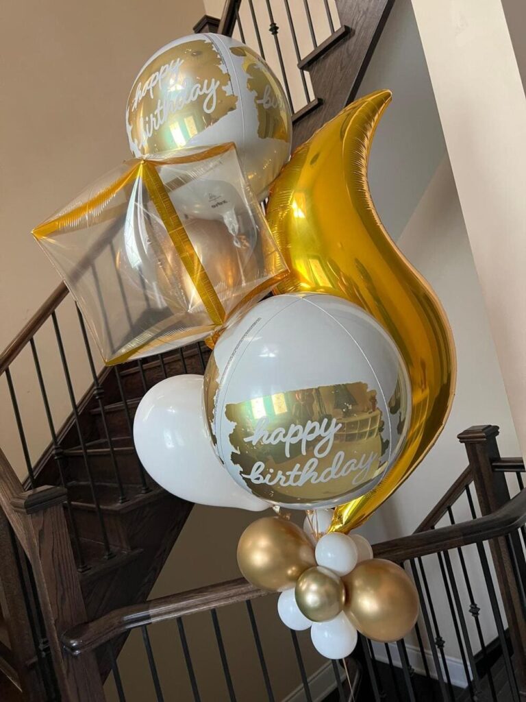 White and gold birthday balloon bouquet