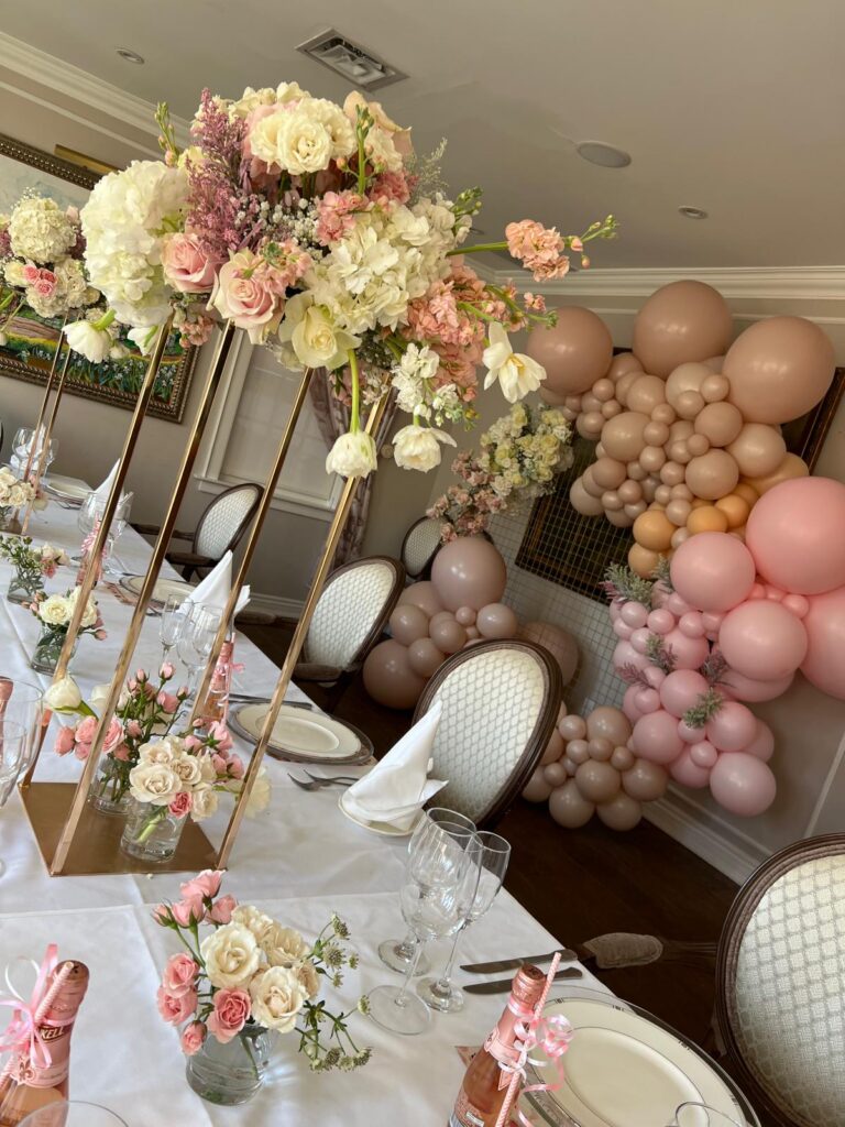 blush balloon garland and flower table decor