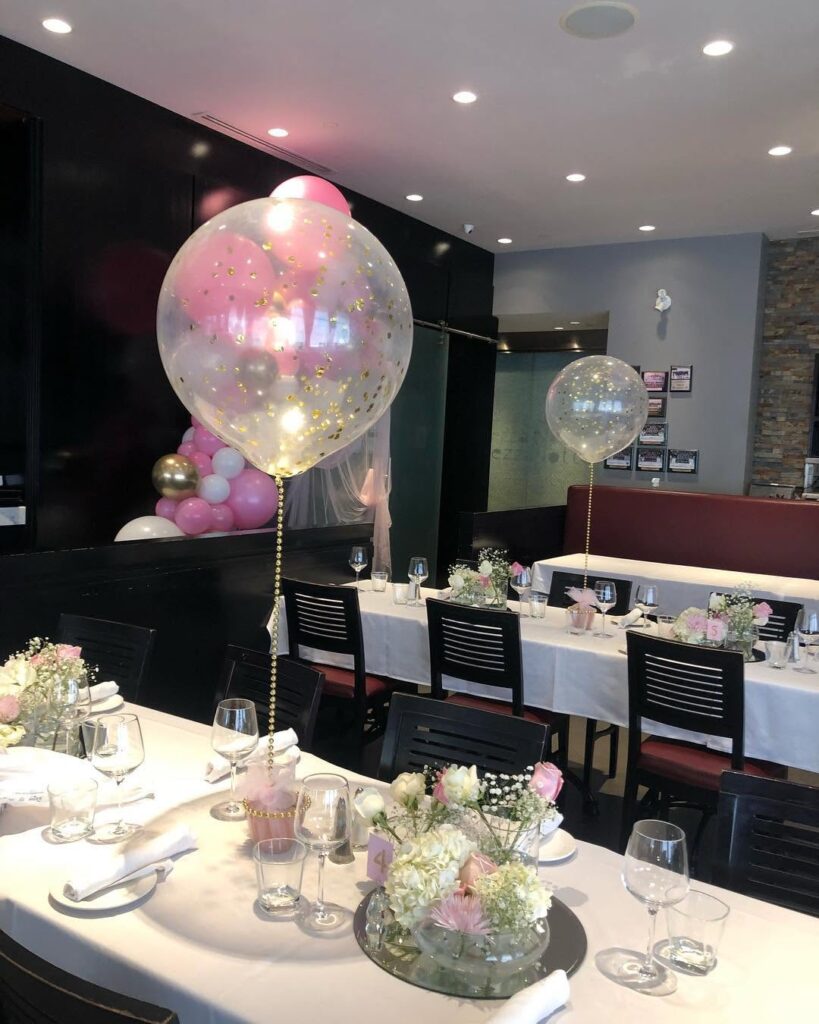 confetti balloon and flower restaurant table decor