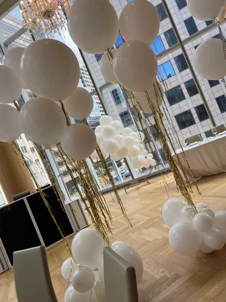 White and gold helium balloon installation