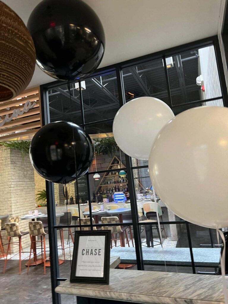 Black and white business event balloons