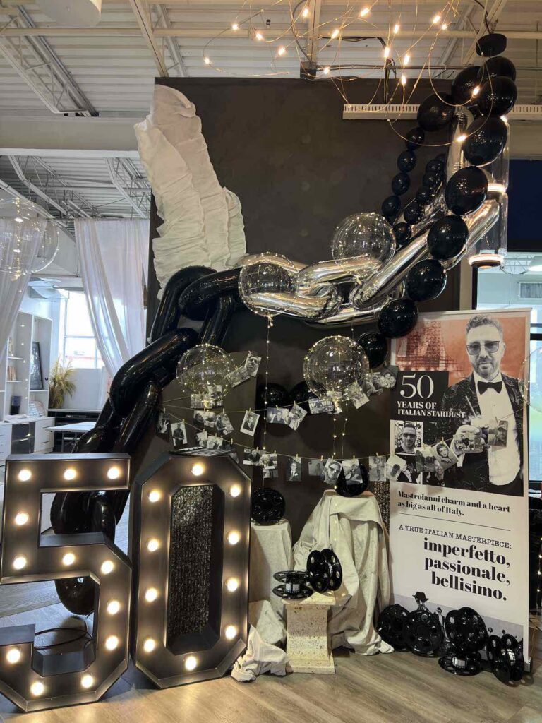Black and silver 50th celebration backdrop