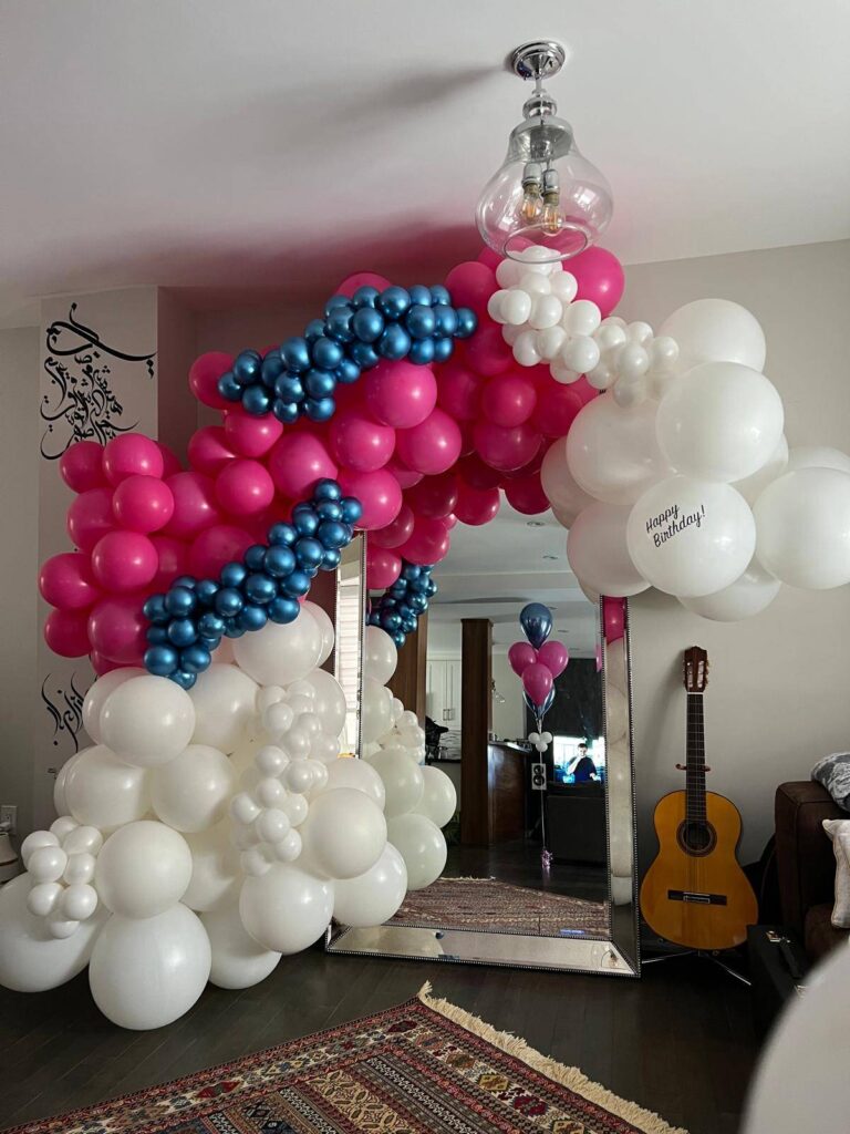 Pink, blue and white balloon arch