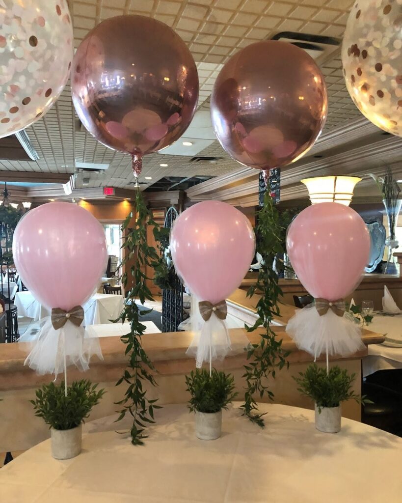 pink balloon and greenery table decor