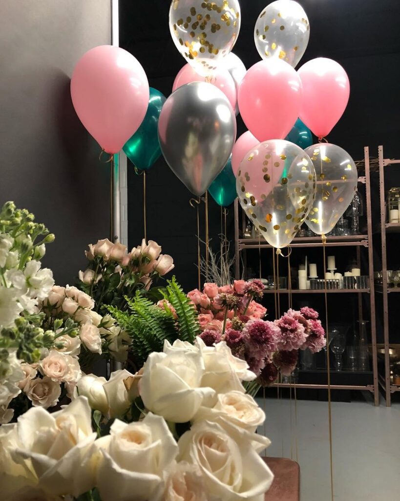 pink balloon and rose floral arrangement